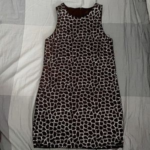 Hi! A gorgeous black dress with silver designs